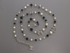 Chanel Long Black Beads, Pearls, and Crystal Logos Necklace